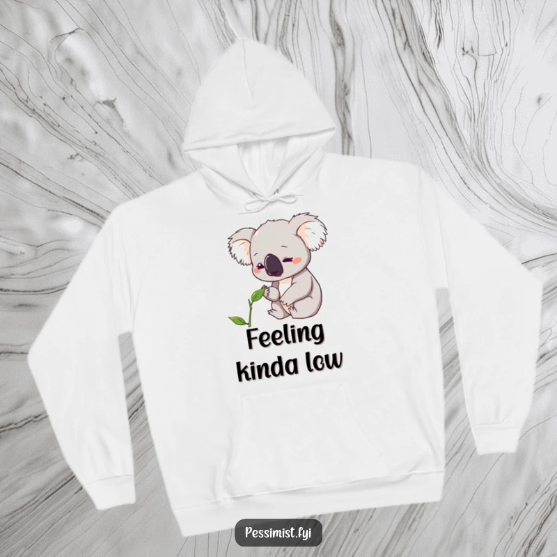 Funny koala hoodie depicting a cute character with a concerned expression over a single, wilting leaf, offering warmth and humor.