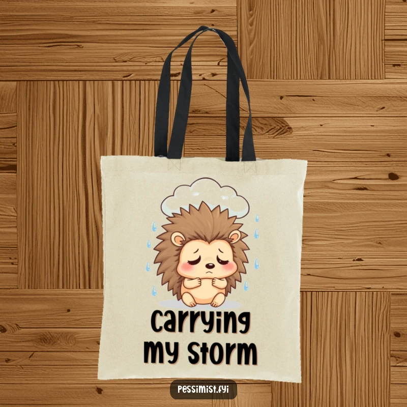 Funny sad hedgehog tote bag showing a character under a rain cloud, sighing, ideal for carrying essentials with a touch of moody humor.